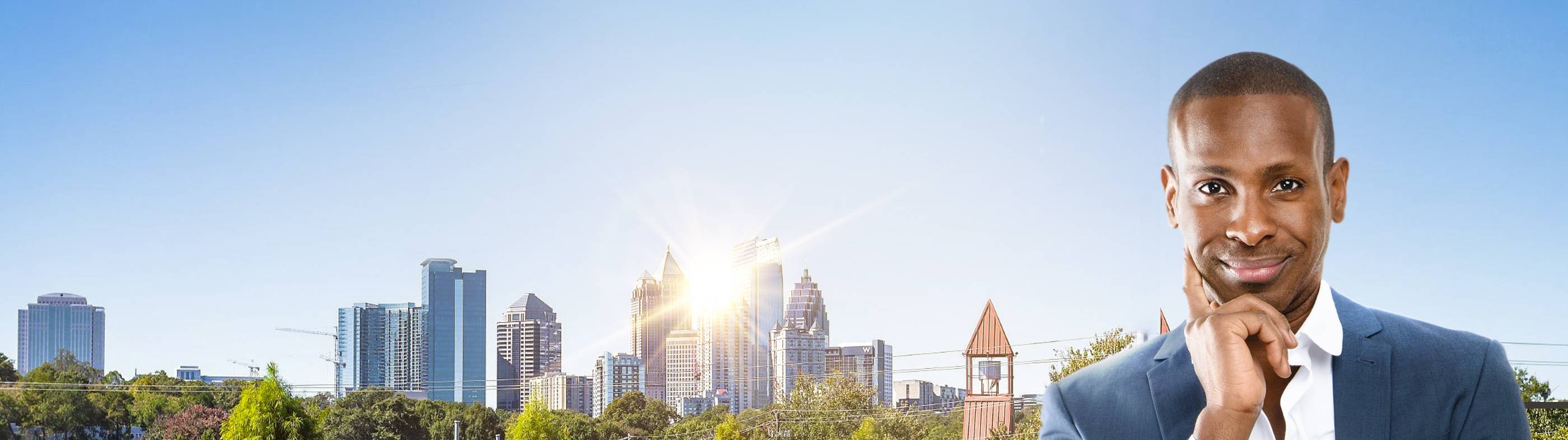 Confident man in suit outdoors, symbolizing natural results from a hair transplant in Atlanta.