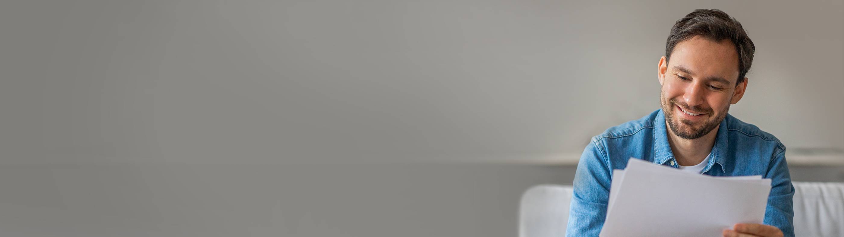 A smiling man with a close-cropped haircut, showcasing the confidence and satisfaction from a successful hair transplant.