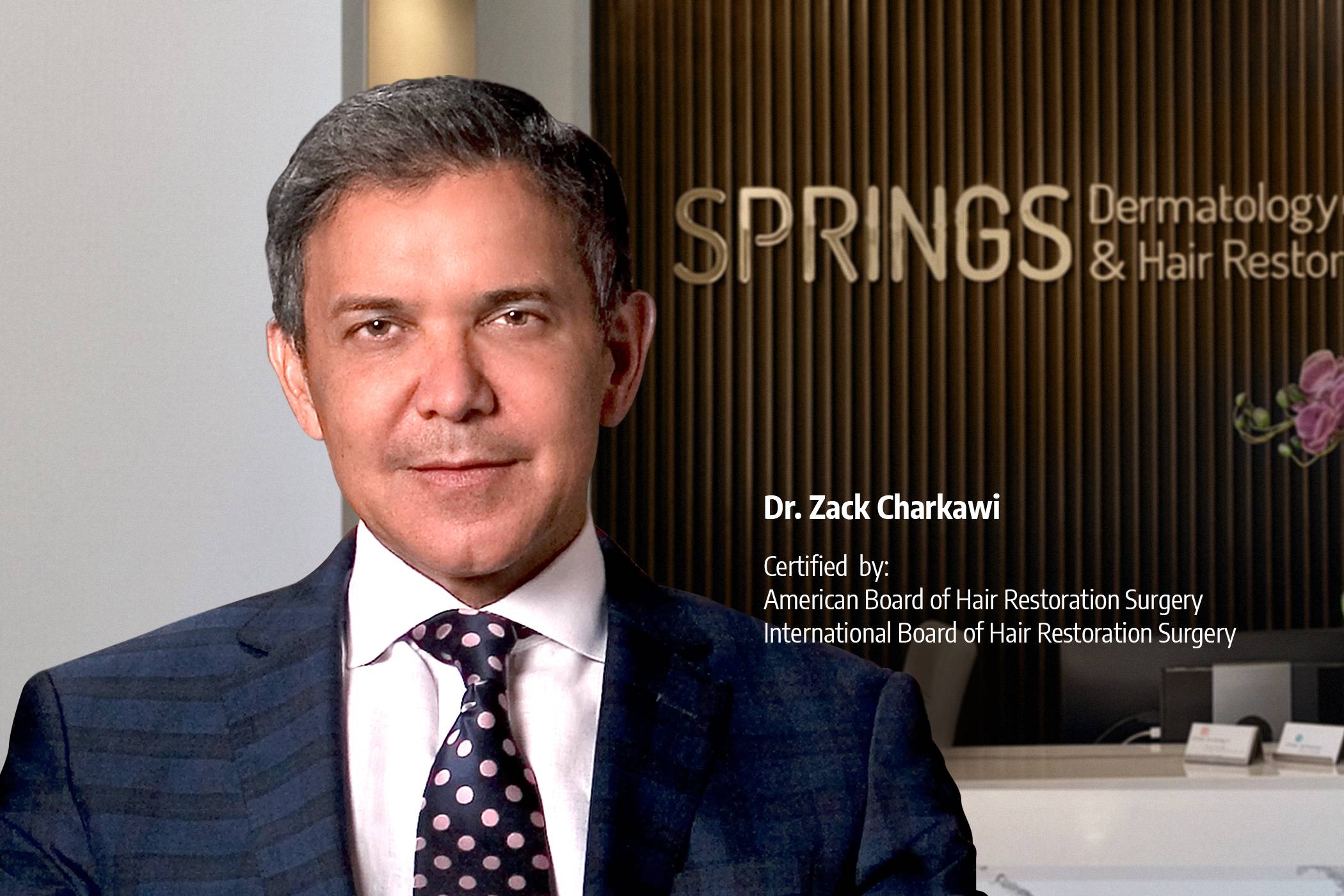 A confident man with a full head of styled, short hair representing successful hair restoration and transplants at Springs Hair Restoration.