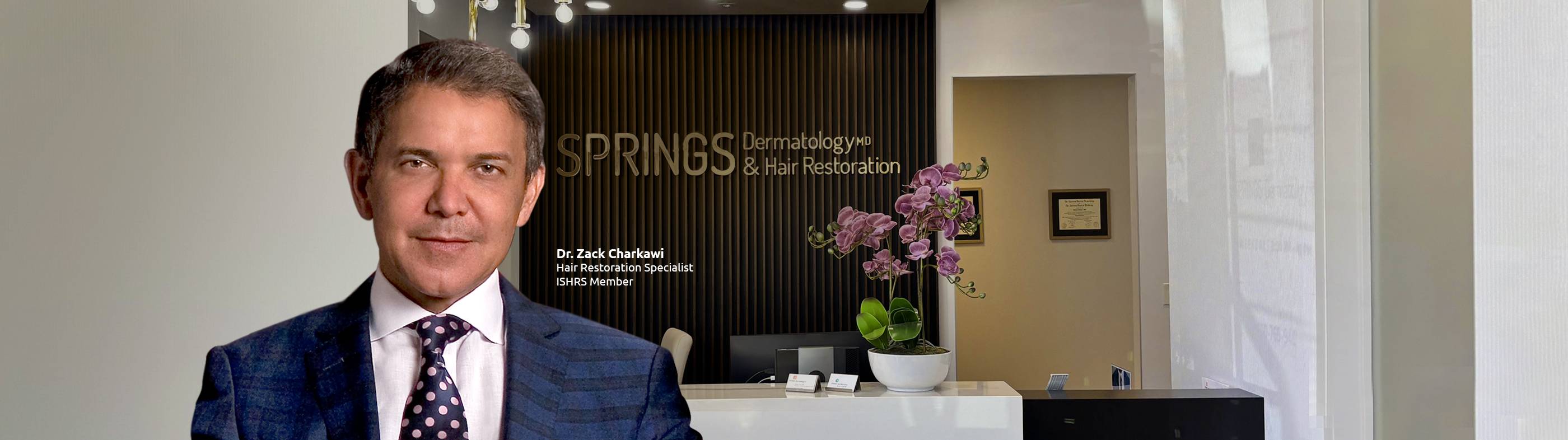 A confident man with a full head of styled, short hair representing successful hair restoration and transplants at Springs Hair Restoration.