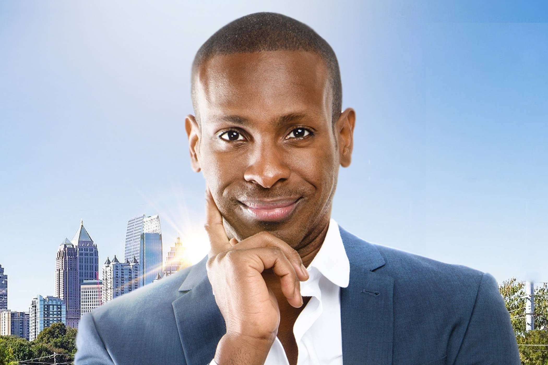 Confident man in suit outdoors, symbolizing natural results from a hair transplant in Atlanta.