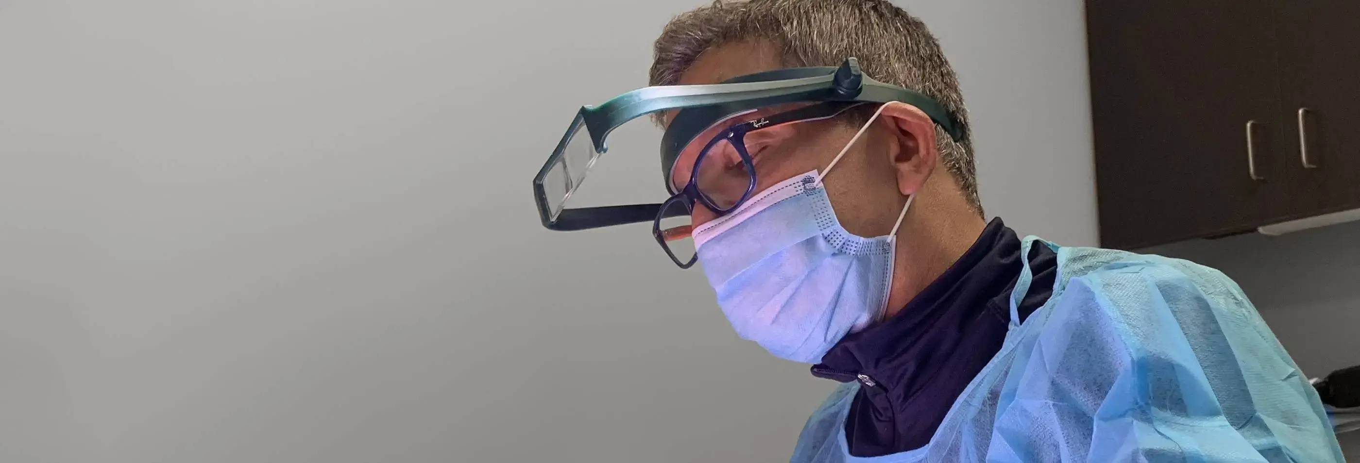 Dr. Zack Charkawi performing a hair transplant surgery at Springs Hair Restoration. The patient is suffering from hair loss.